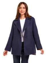 Load image into Gallery viewer, Woman wearing a navy blue alpaca jacket on a white background
