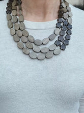 Load and play video in Gallery viewer, Grey Hardwood Oval and Bronzite Flower Necklace
